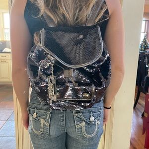 Like new Authentic Coach small/medium sequin backpack.